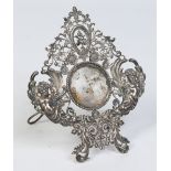 A 19th century white metal pocket watch stand.