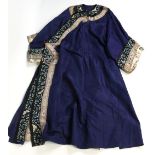 An early 20th century Chinese purple silk Mandarin robe with gilt metal buttons.