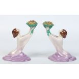 A pair of Art Deco Wilkinson pottery figural candlesticks.