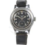 A World War II "dirty dozen" British military issue Longines manual wristwatch in stainless steel