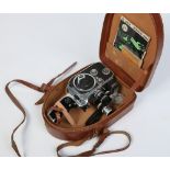 A cased Paillard Bolex D8L cine camera with three lenses.