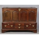 A period oak mule chest. With panelled front and raised on bracket supports, 149cm wide.