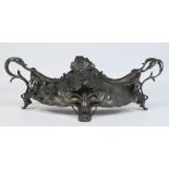 A WMF style pewter centrepiece. With twin scrolling handles and applied flowers. 57cm wide.