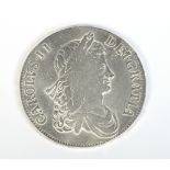A Charles II 1663 silver crown. Obv. laureate bust. Rev.