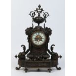 A 19th century French bronze cased Neoclassical style mantel clock.