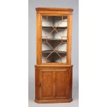 A Victorian light oak corner cupboard with astrigal glazed top and panelled cupboard base, 194cm.