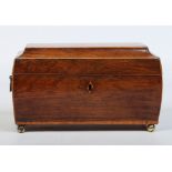 A Regency boxwood tea caddy, with fitted interior, brass loop handles and ball feet, 28cm wide.