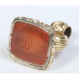 A Victorian yellow metal seal fob with engraved agate matrix. 3cm, matrix 17mm x 15mm.