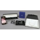 A collection of boxed silver jewellery to include Swarovski earrings, a 925 stamped bangle,