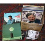 A collection of L.P records and compact discs to include rock and roll etc.