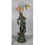 A bronzed base figural two branch tablelamp and shades.