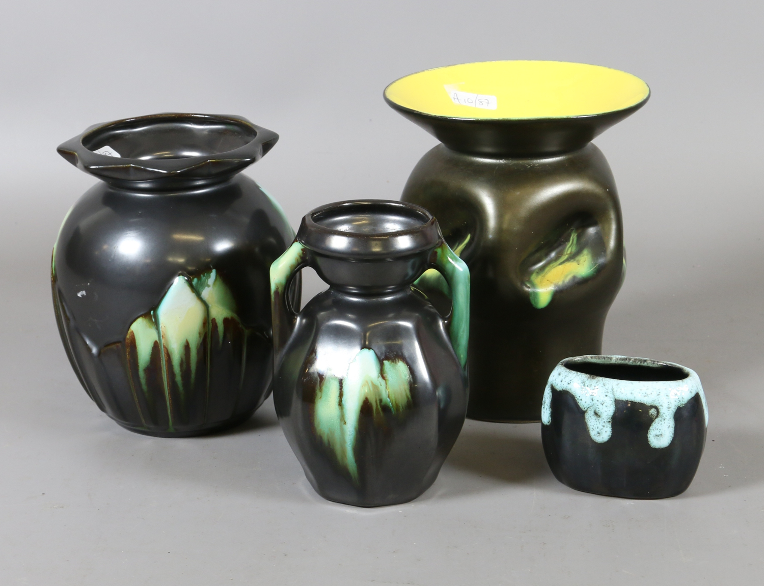 Four Belgian art pottery vases black ground and with coloured glazes.