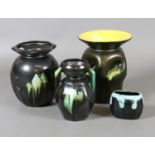 Four Belgian art pottery vases black ground and with coloured glazes.