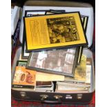 A suitcase and contents of hardback books various titles and subjects along with a collection of