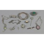 A small box of silver jewellery to include rose quartz pendants, brooches, etc.
