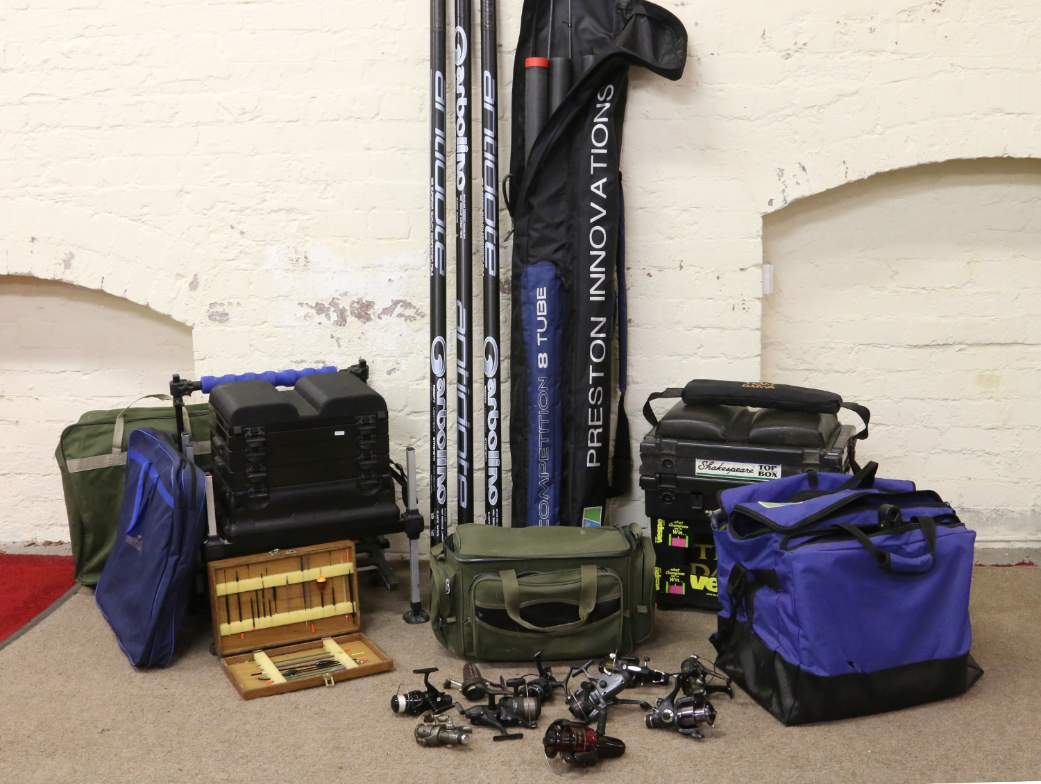 A large collection of fishing equipment to include Shakespeare carry boxes with contents of floats,