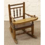 A turned mahogany childs rocking chair.