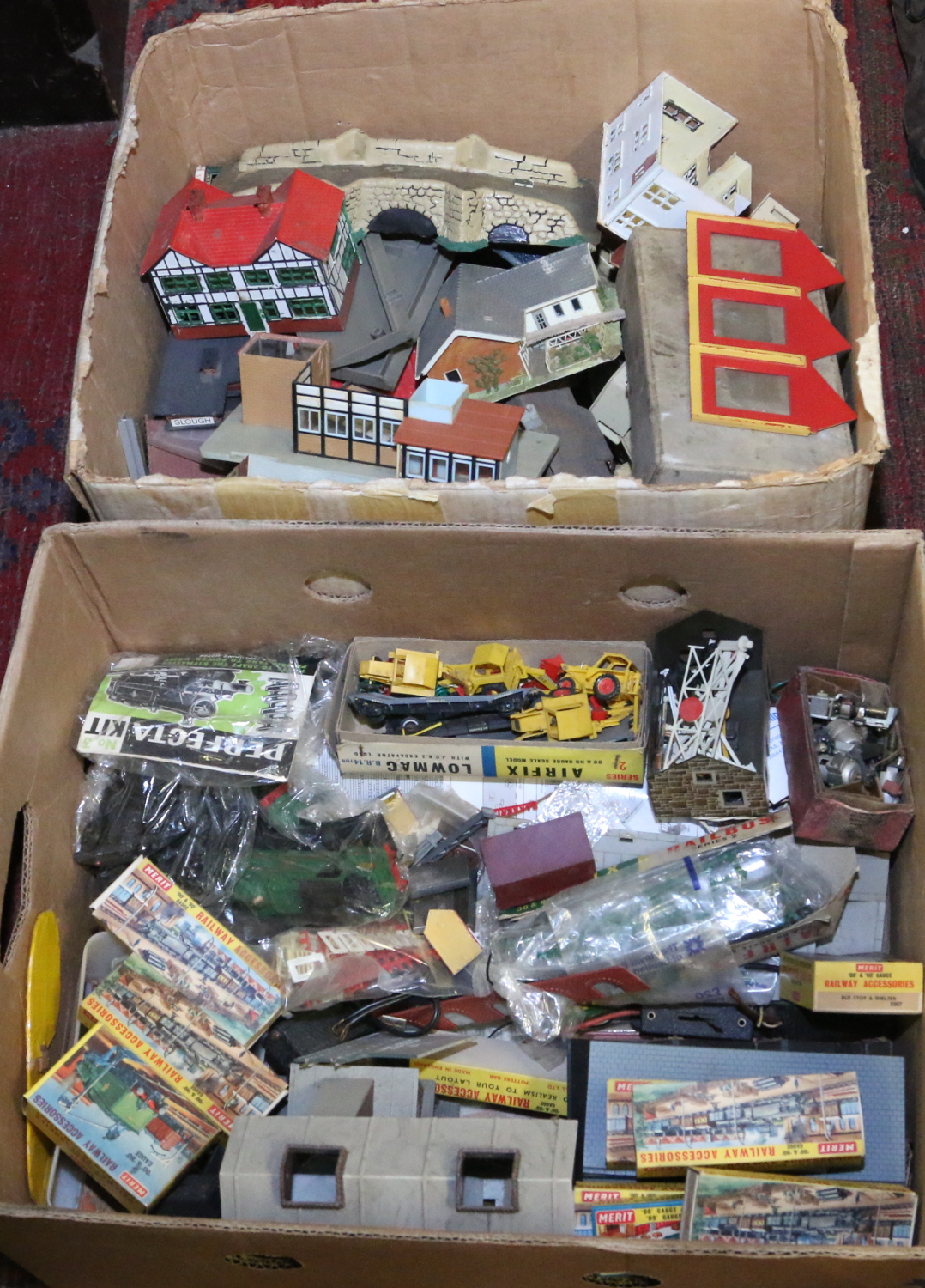 Two boxes and contents of various model railway accessories to include trackside buildings,