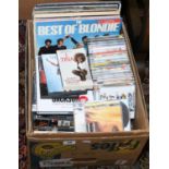 A box and contents of L.P records and compact discs, rock, pop and easy listening etc.