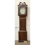 An oak grandfather clock case with handpainted arched dial, lacking movement (AF).