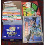 A collection of various childrens annuals and books along with three boxed games.