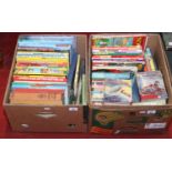 Two boxes of hardback books including many childrens titles and annuals.