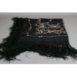 A Chinese multi coloured embroidered shawl decorated with flowers and birds,