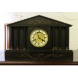 A Victorian slate mantel clock.