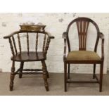 A smokers bow armchair in need of restoration along with a pierced back armchair.