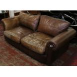 A large brown leather sofa retailed by The House of Fraser.