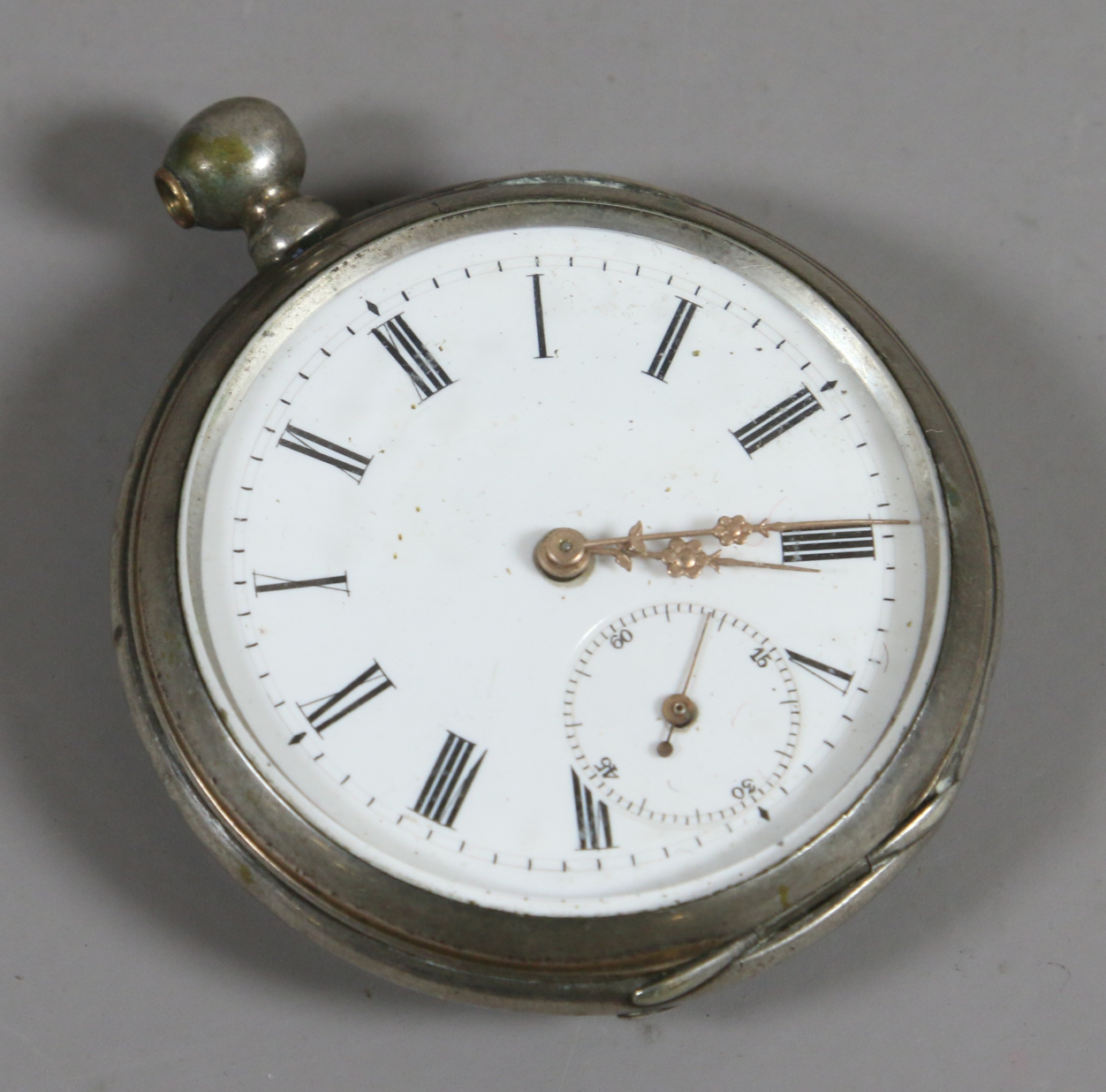 A Continental silver cased pocket watch with subsidiary seconds dial and Roman numeral markers.