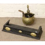 An iron and brass bedroom fire fender, a decorative brass jardiniere,