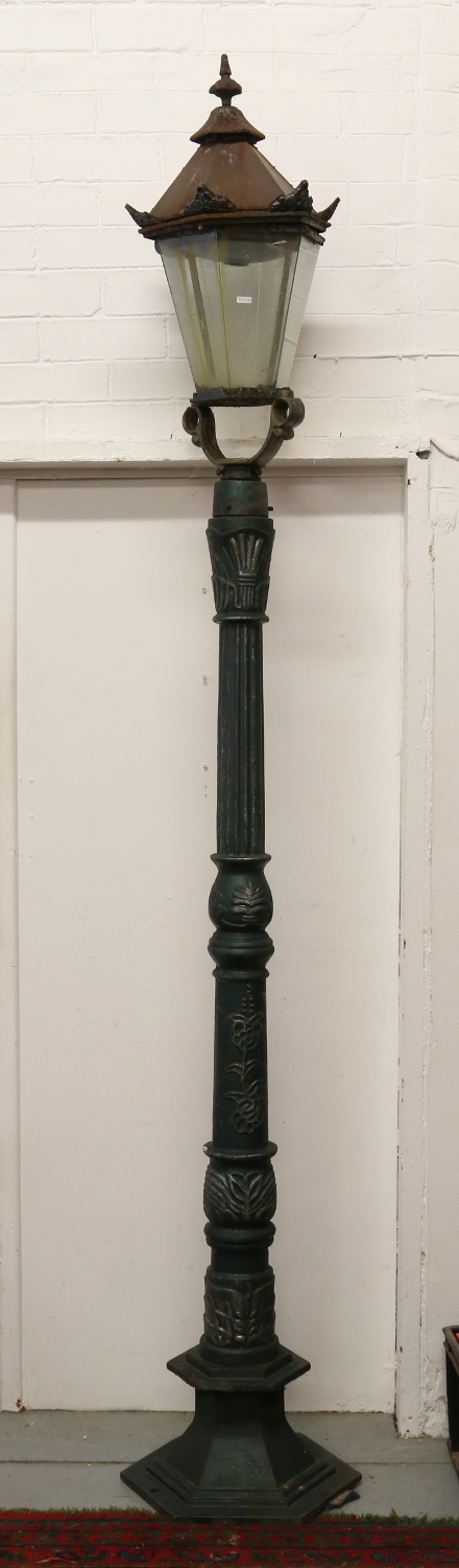 A painted cast iron lamp post.