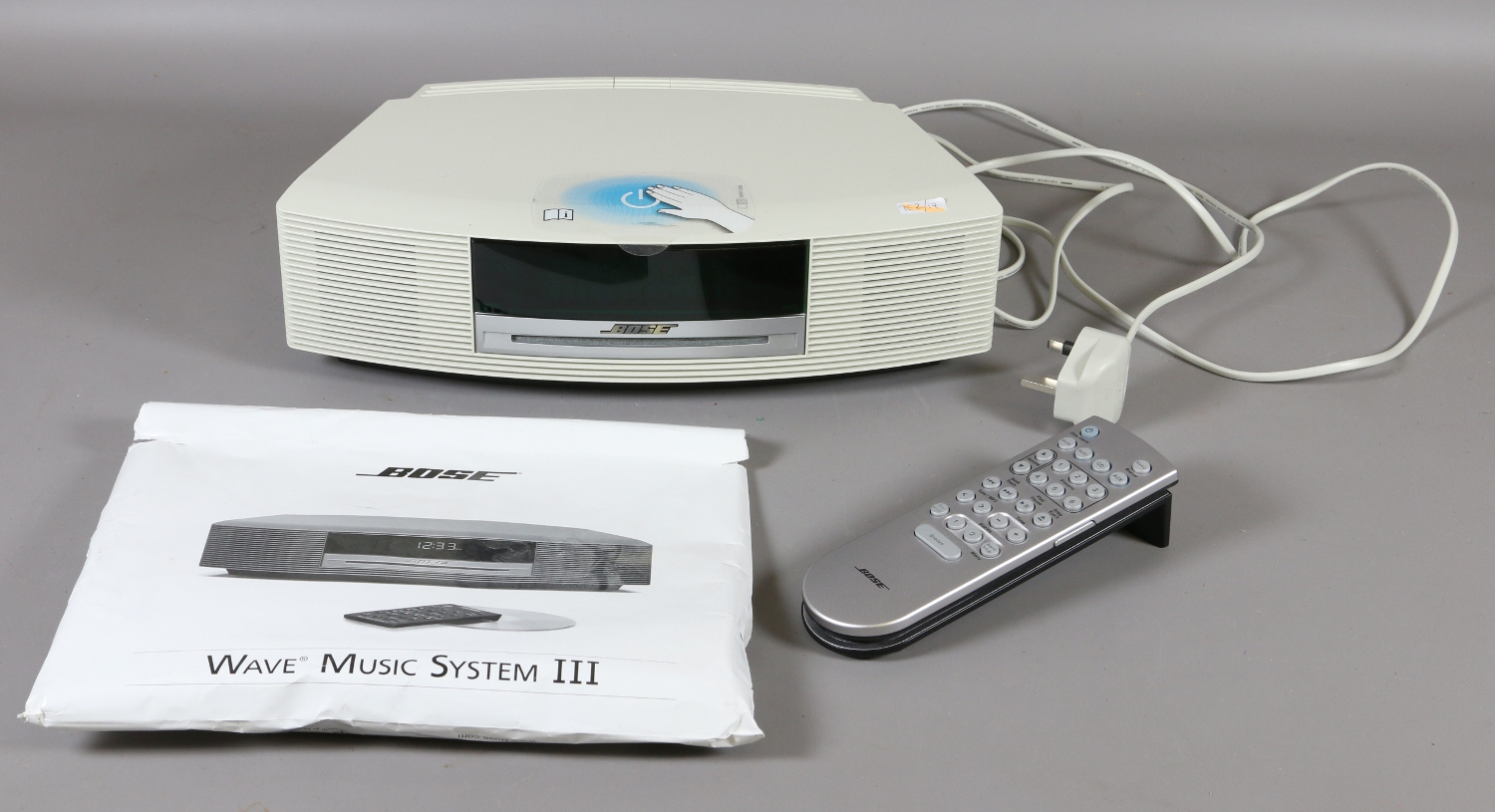 A Bose Wave music system 111 with remote control and manual { in office }