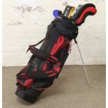 A Dunlop golf caddy bag and contents of carbon fibre and steel clubs.