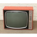 A retro Murphy television in bright red case.