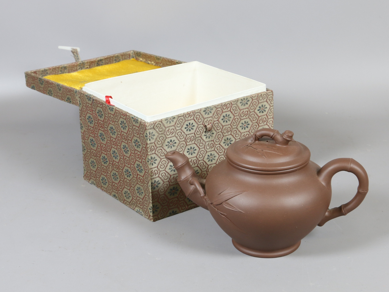 A 20th century Chinese Yixing teapot in fitted box.