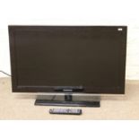 A Samsung 32" flatscreen television and remote control.