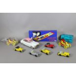 A collection of vintage tin plate toy/model cars including boxed examples.
