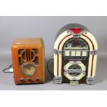 Two novelty radios one in the form of a Wurlitzer style juke box and the other formed as an Art