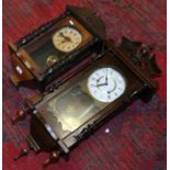 An Edwardian spring driven wall clock and a thirty one day wall clock chiming on a gong.