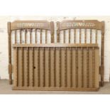 A childs turned wooden cot, needs assembling.