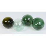 Four blown glass fishing floats, 12cm diameter. Condition Report.