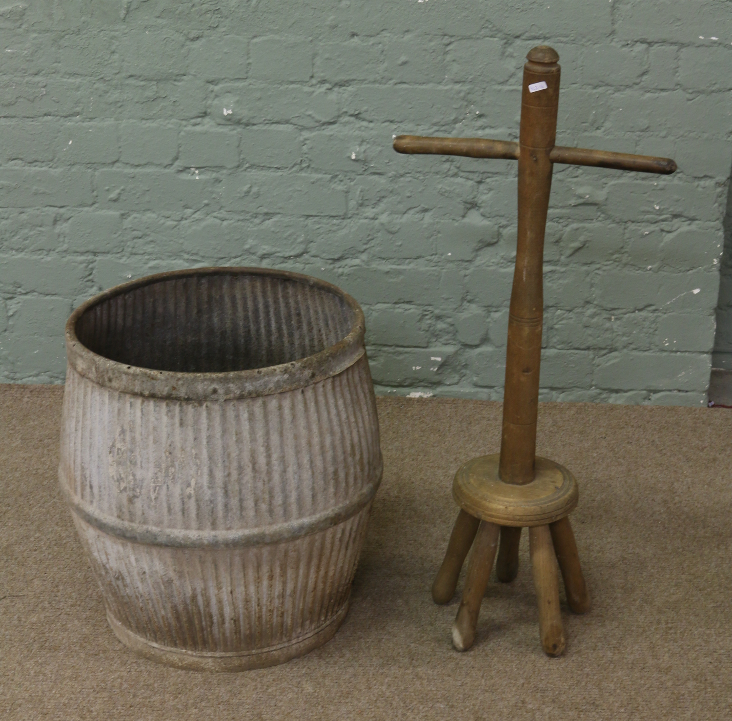 A galvanized dolly tub and five leg posser.