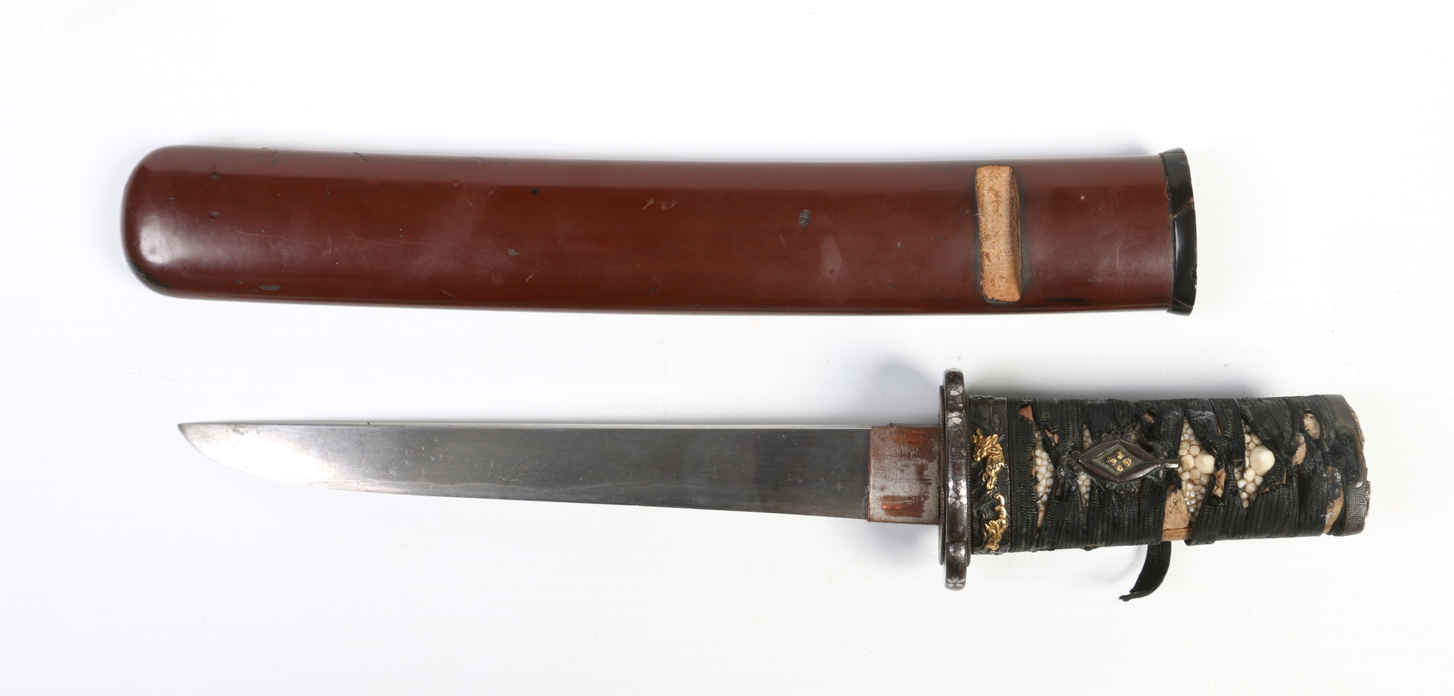 A Japanese Edo period tanto dagger in lacquered sheath.