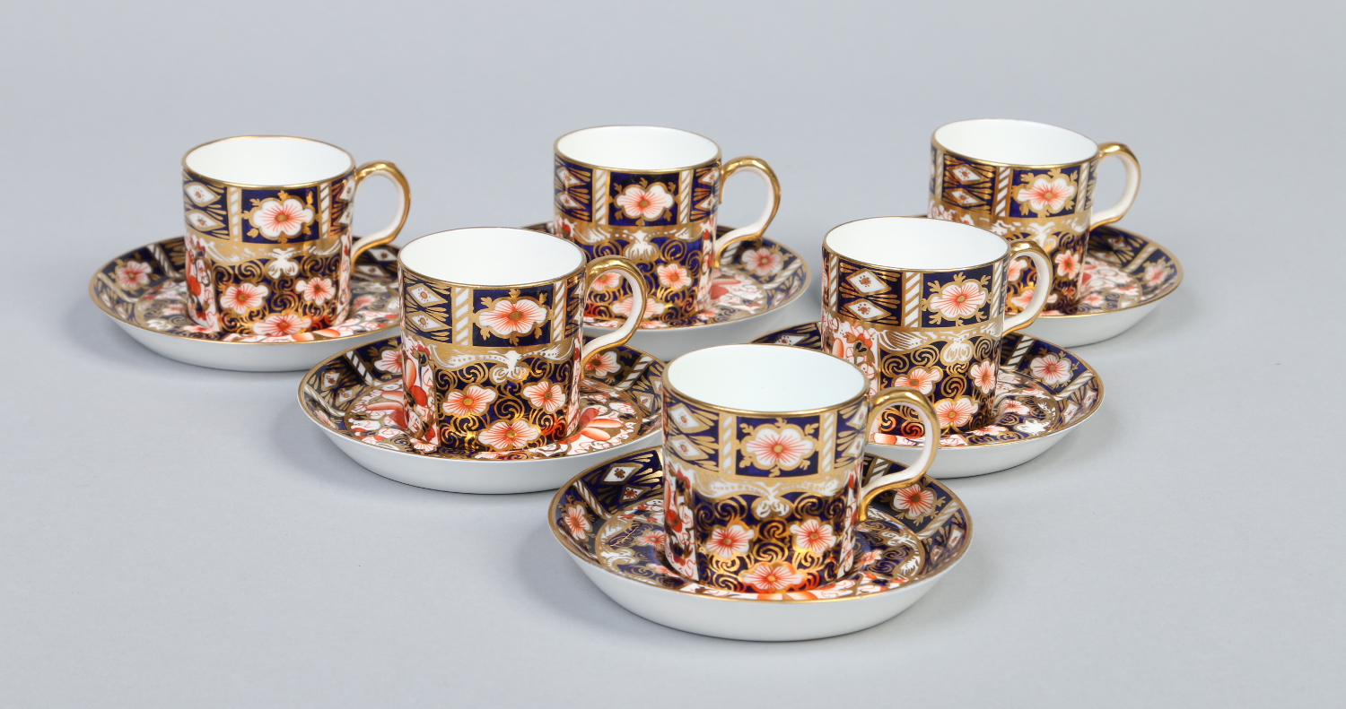 A set of six Royal Crown Derby demitasse coffee cans and saucers decorated in the Imari style.