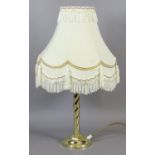 A brass effect rope twist table lamp and shade.