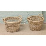 Two wicker baskets with twist handles.