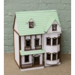 A modern painted dolls house.