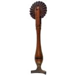 An unusual turned boxwood pastry jigger with wheel, baluster stem and carved arced cutter,